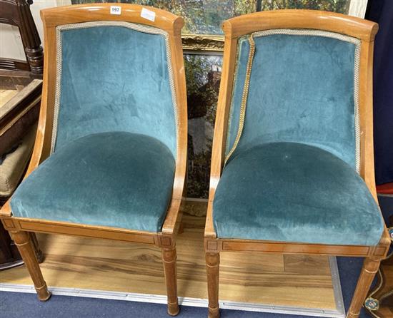 A pair of Biedermeier style birch tub chairs, height 85cm